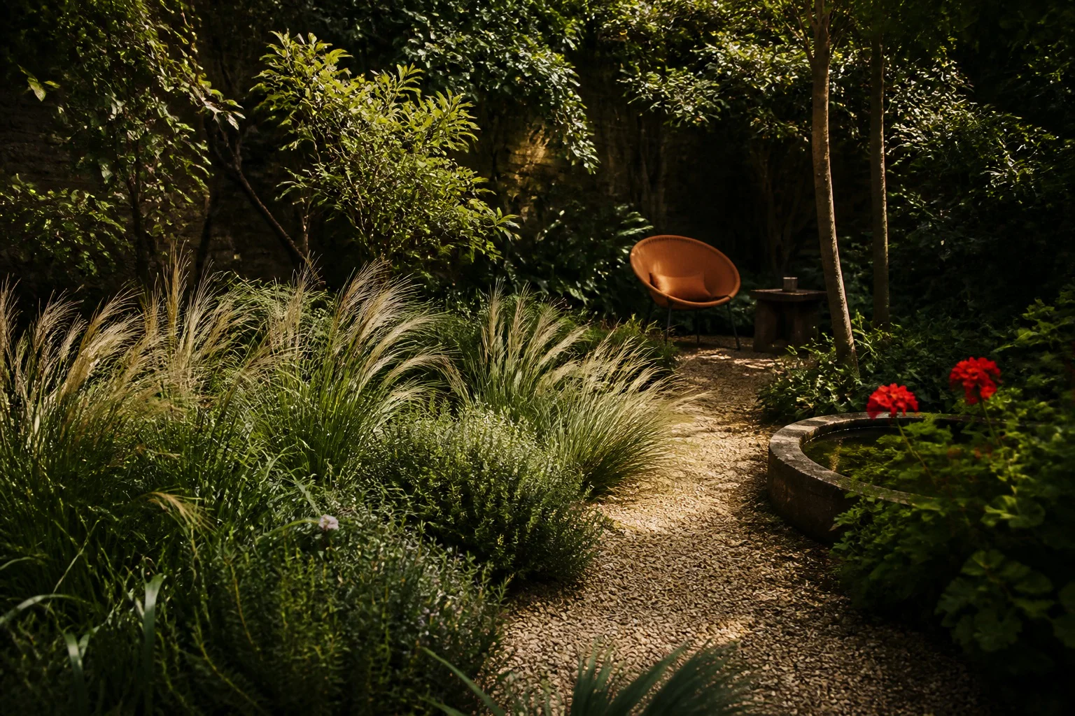 A gravel path passes tactile herbs and moving grasses toward an orange chair partly concealed in a layered green garden.